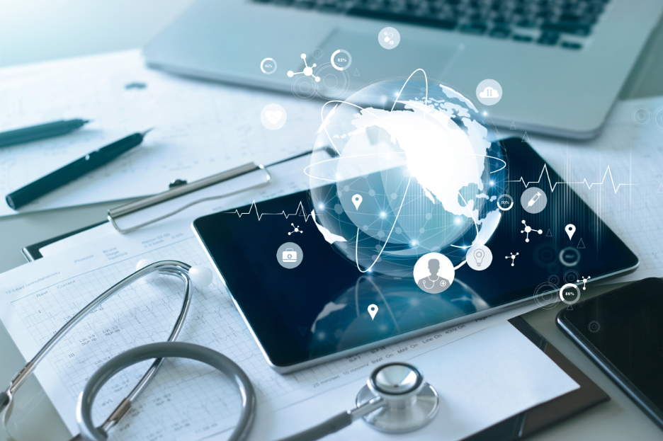 Tablet with stylised globe health symbols and stethoscope.