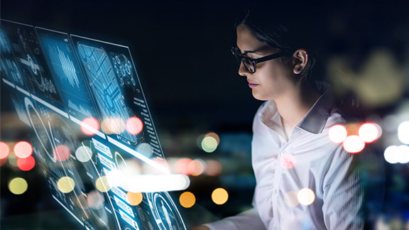 Woman standing in front of transparent screeen