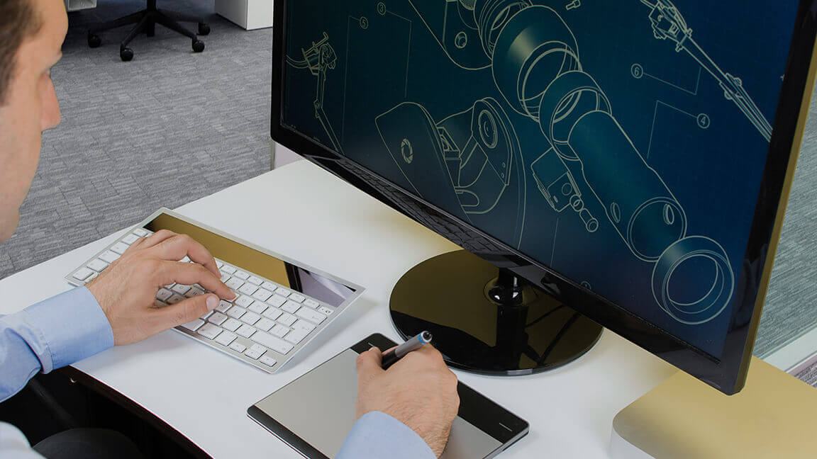 Man drawing components on a computer