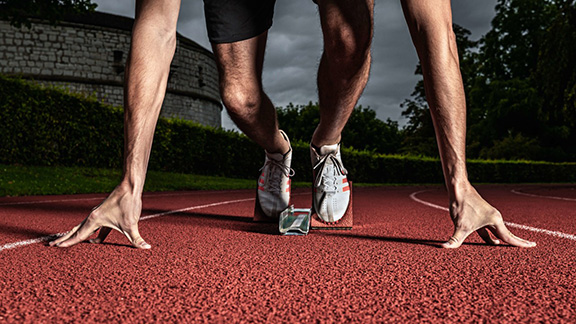 Male runner in starting block