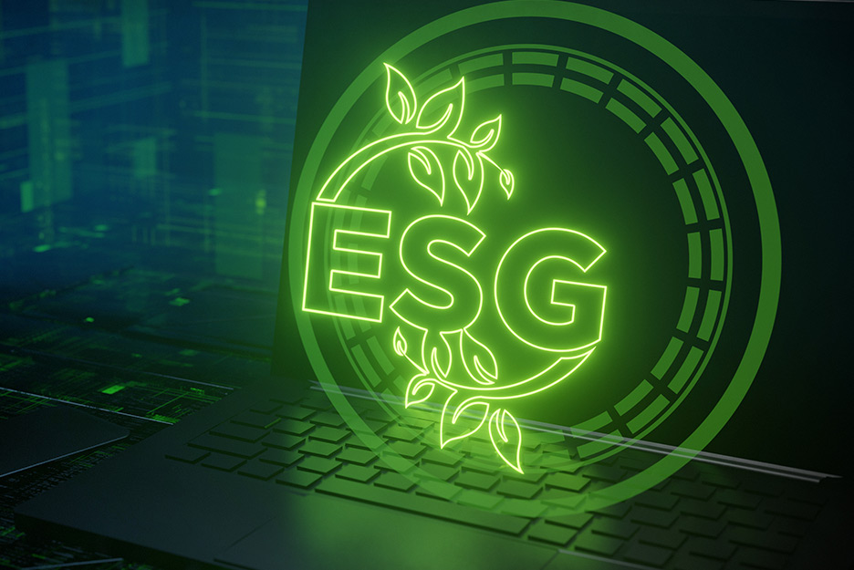 An opened laptop with the shining letters ESG inside a circle above in green