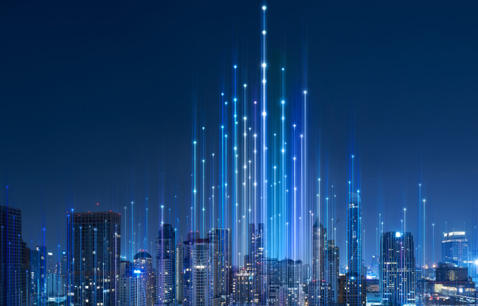 Skyline at night with stylised lights and waves representing virtual connectivity.