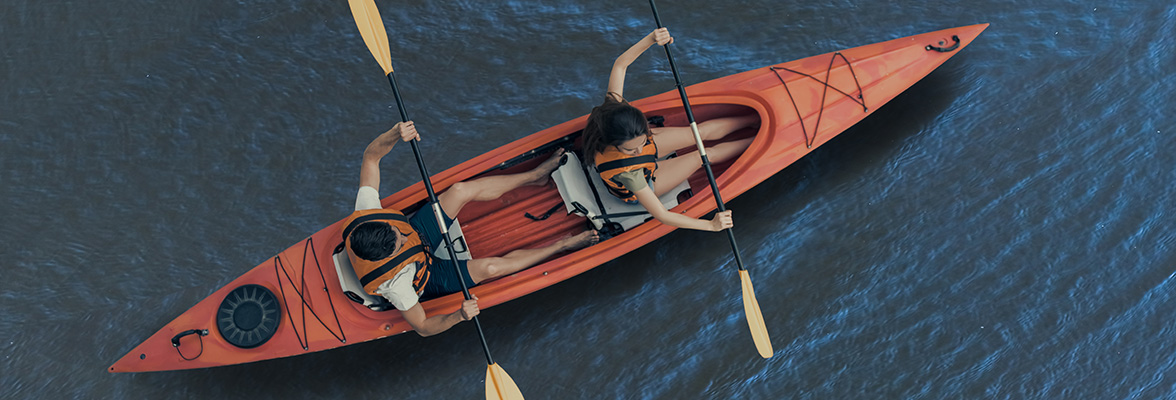 Woman and man in kayak on the water