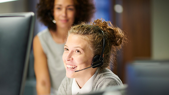 Woman with headset at customer service